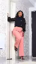 Peach pants standing.webp